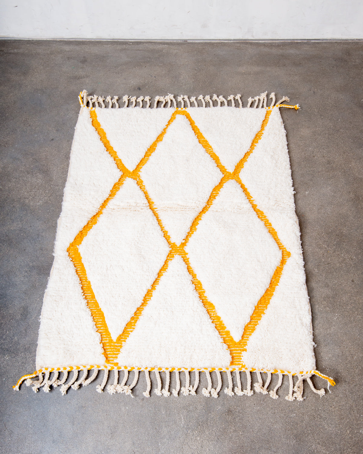 Modern, designer, handcrafted Berber rug from Morocco. Beniourain carpet with beautiful colours and patterns and fluffy wool texture.